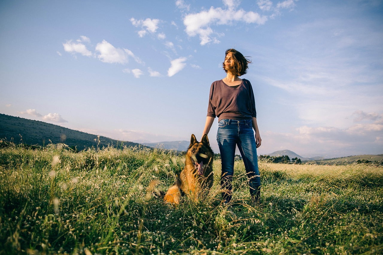 Woman with her dog enjoying a settled life outdoors in BC