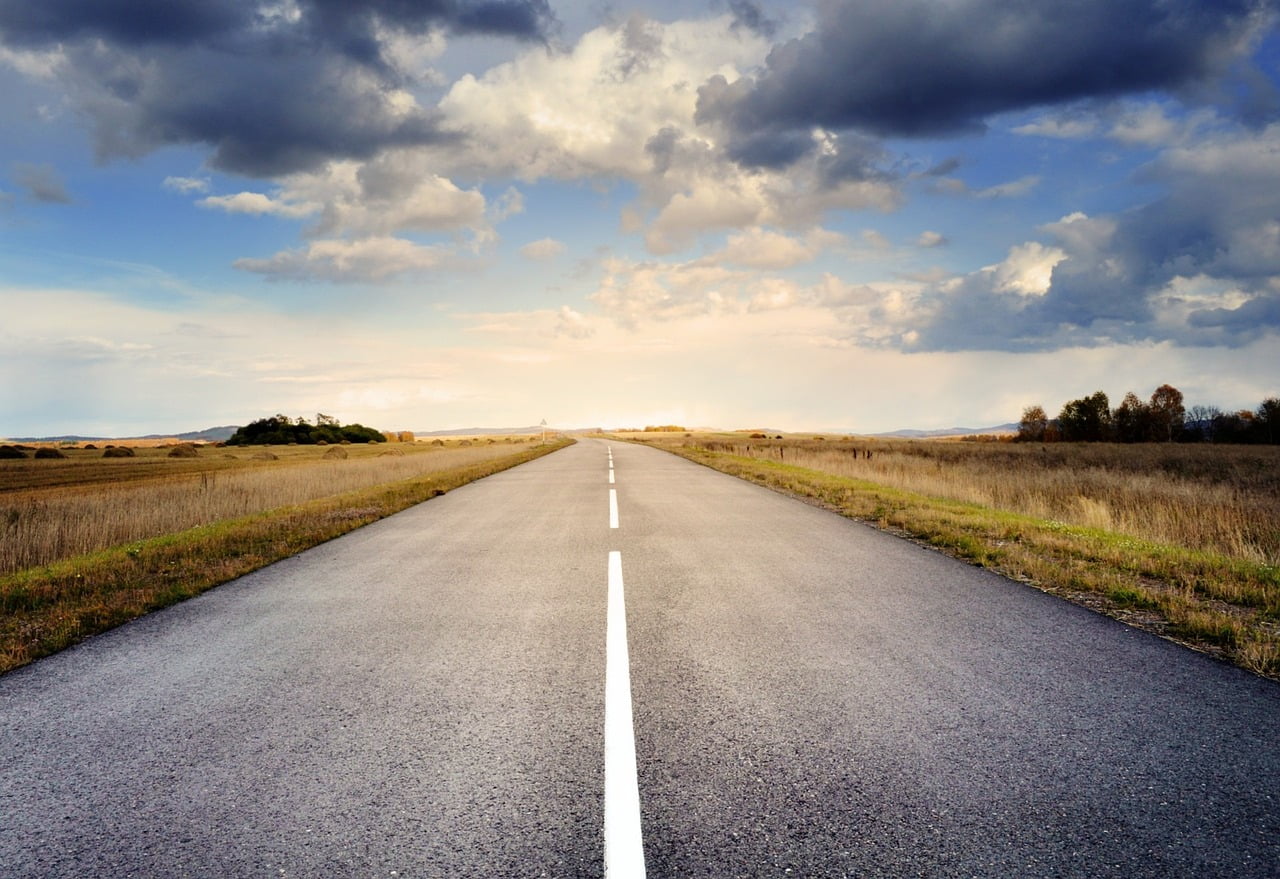 An open road stretching toward the horizon — a clear path forward
