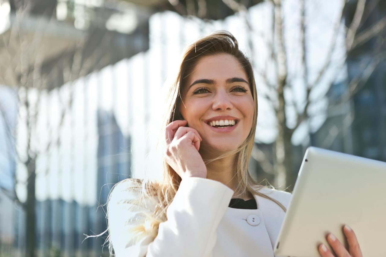 Client meeting remotely using a tablet outdoors